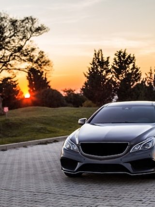 grey-luxury-sedan-car-sunset_114579-4045